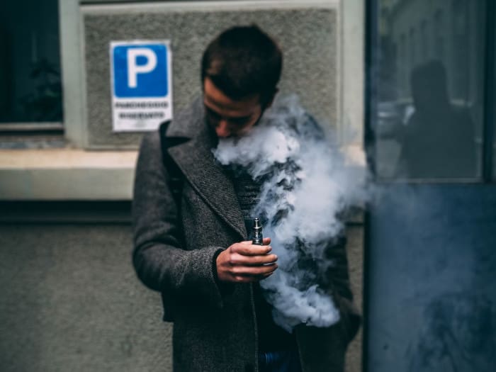 man vaping outside